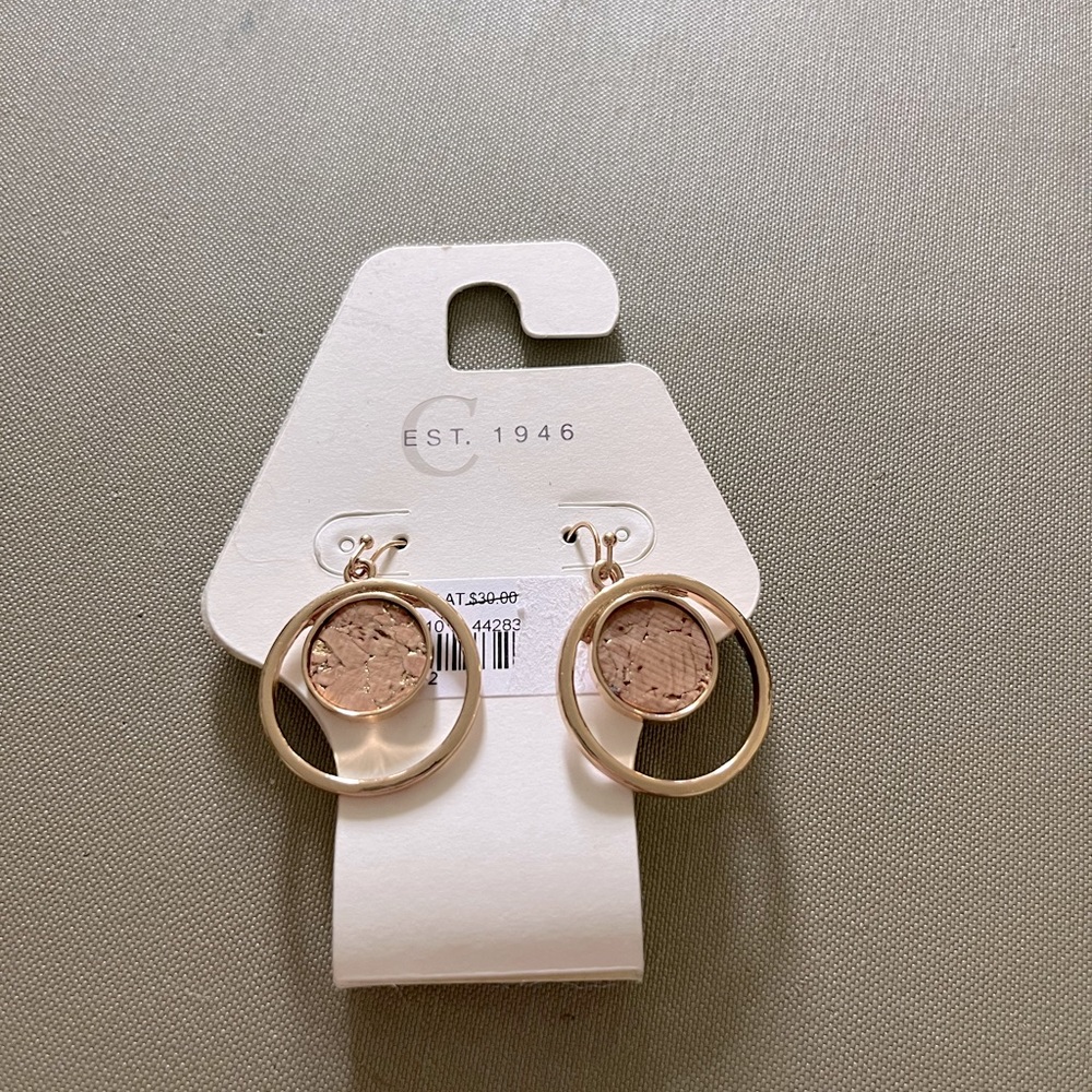 Gold and cork dangle hoop earrings.